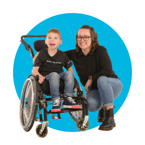 A disability support worker smiling with a child with complex care needs